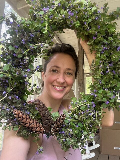 Amanda Looking Through an Herbal Wreath of Ground Ivy